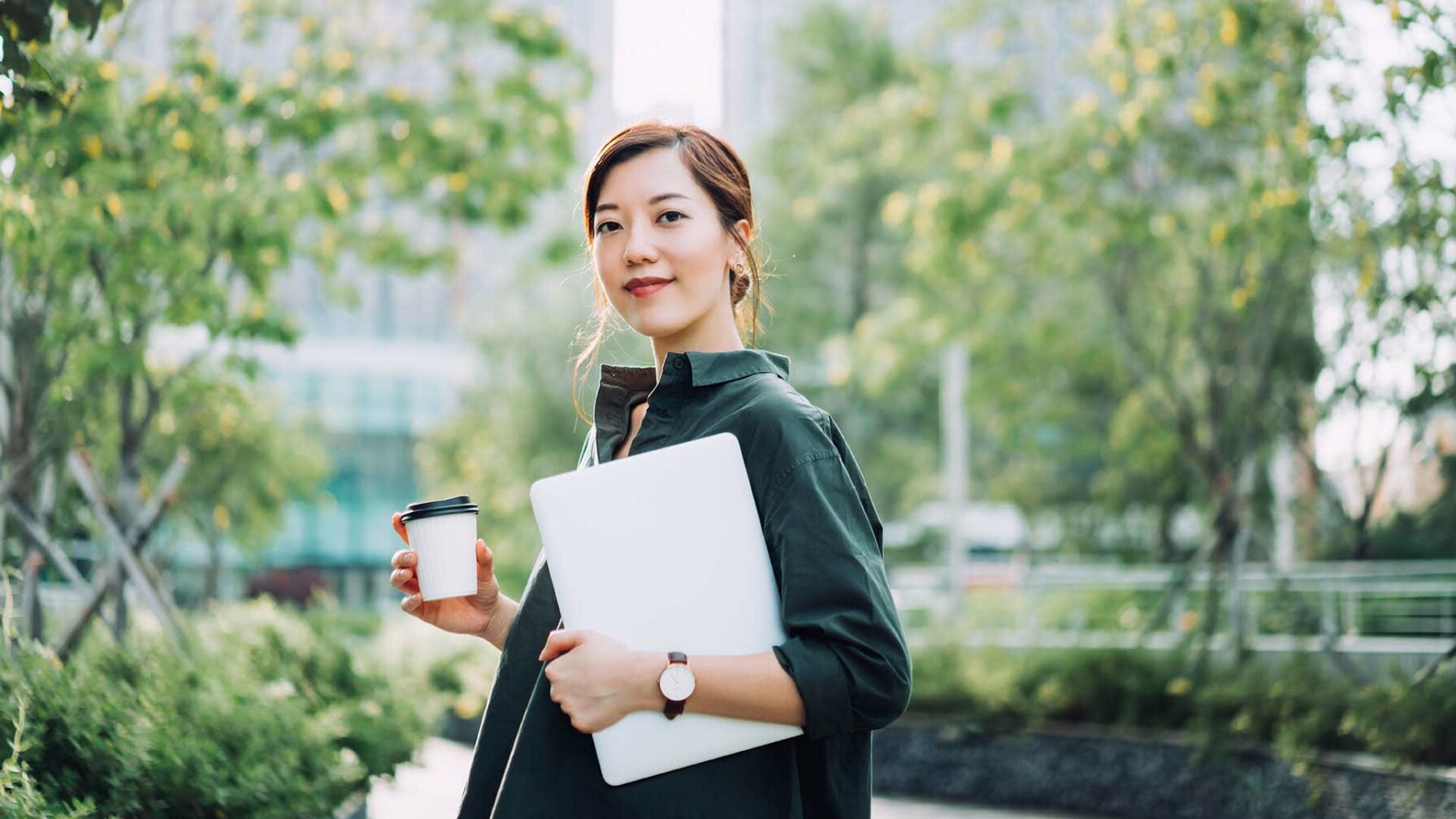 Asian female leader holding coffee